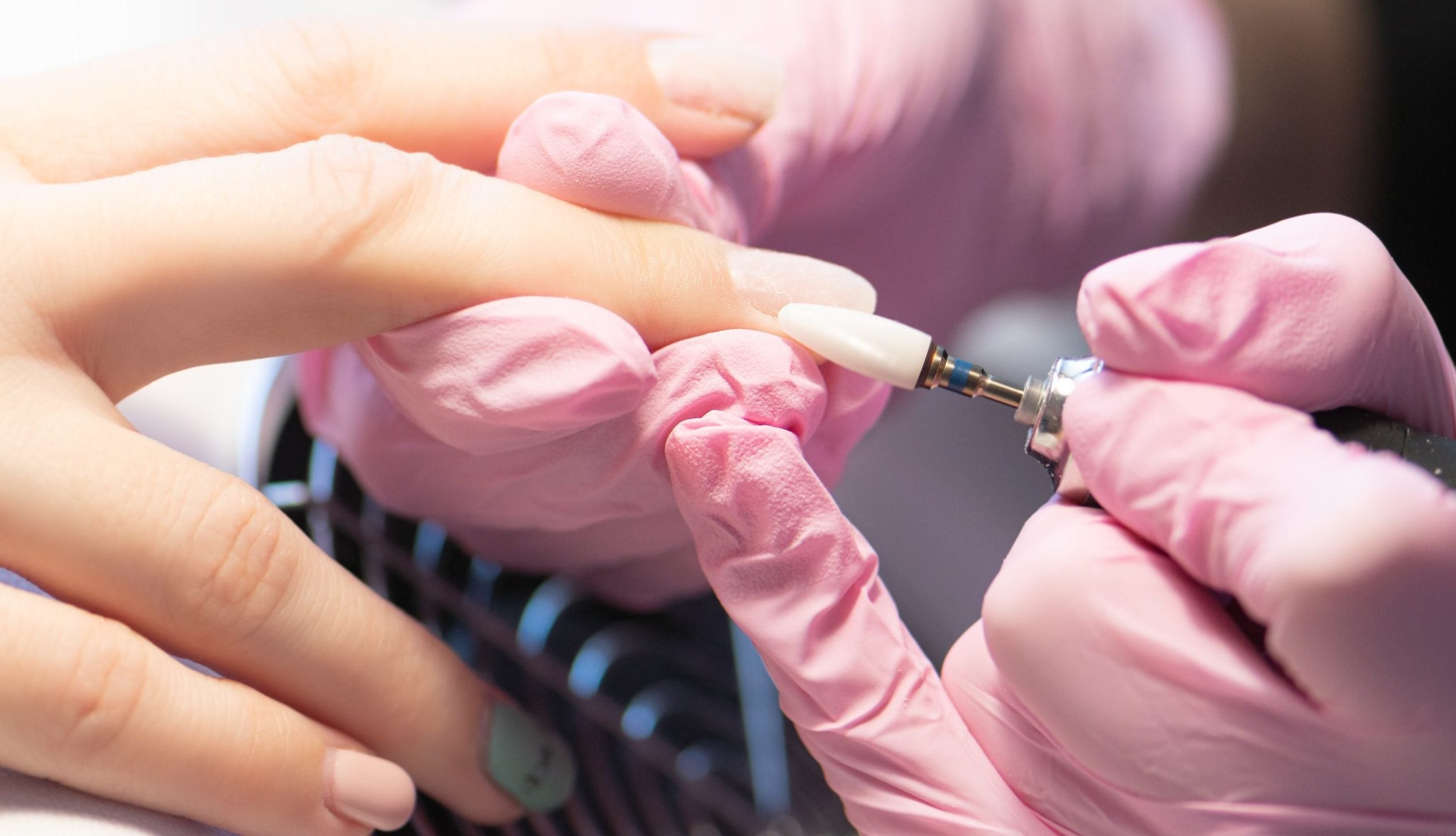 manicurist-doing-gel-nail-design-for-client-close-up_11zon