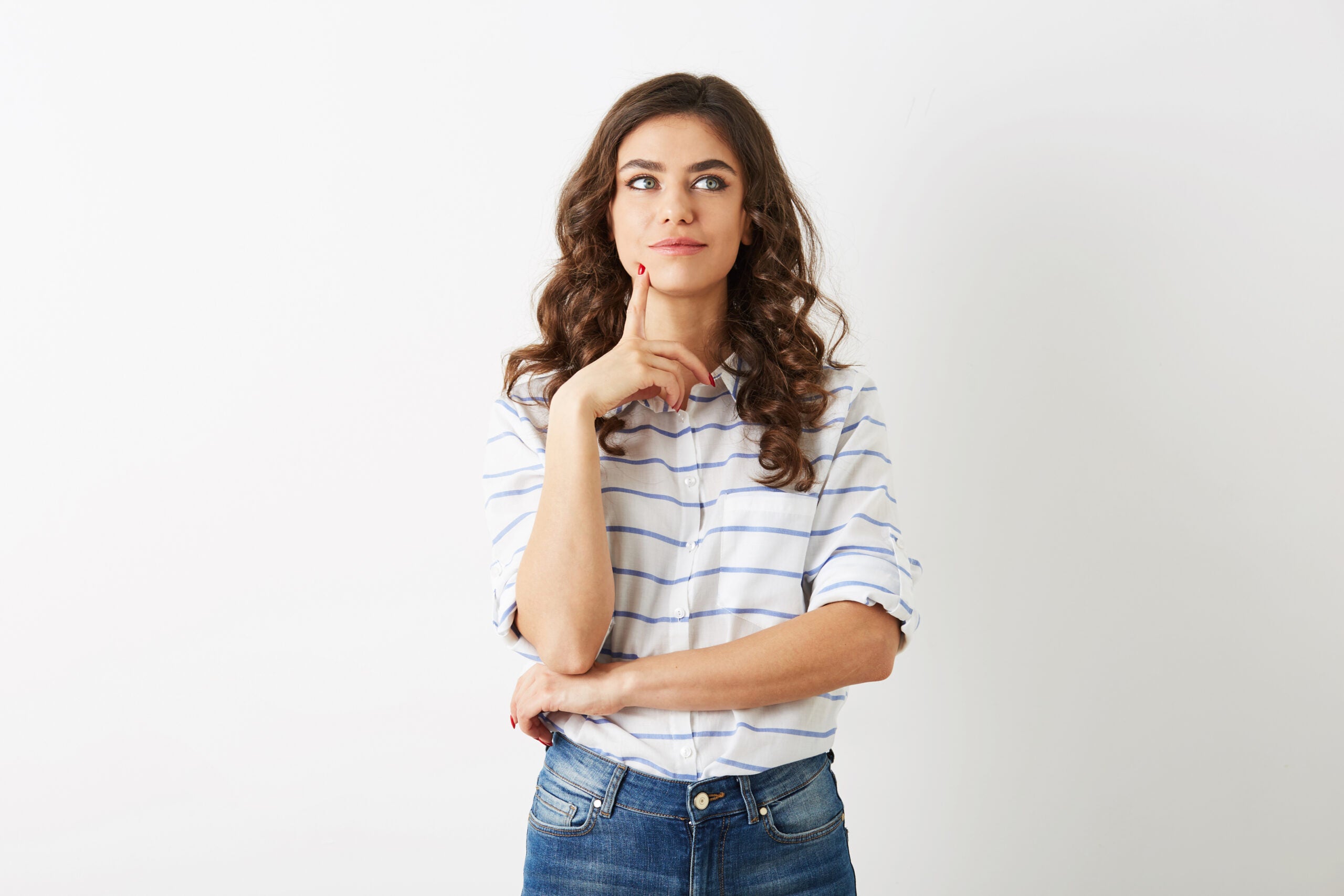 beautiful young woman, concentrated face expression, thinking on problem, teenage hipster style, dressed in jeans , shirt, isolated on white background, modern fashion, worried, busy